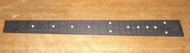 Fretboard with dot markers