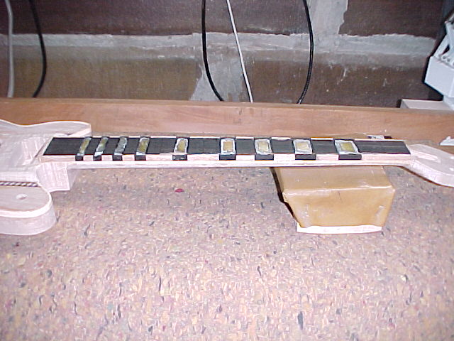 Fretboard bindings glued on